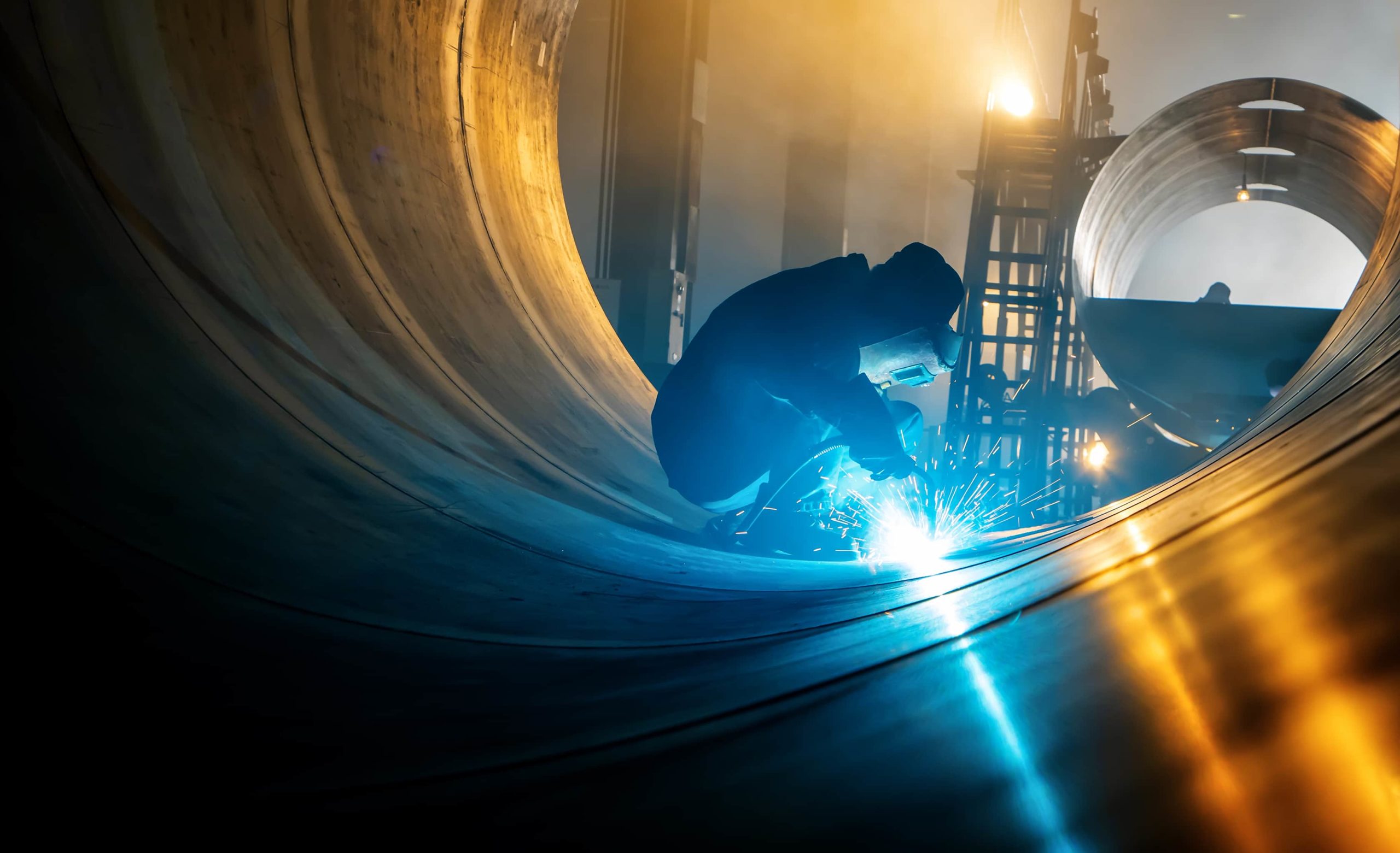 Worker welding Steel made from Warrior coal